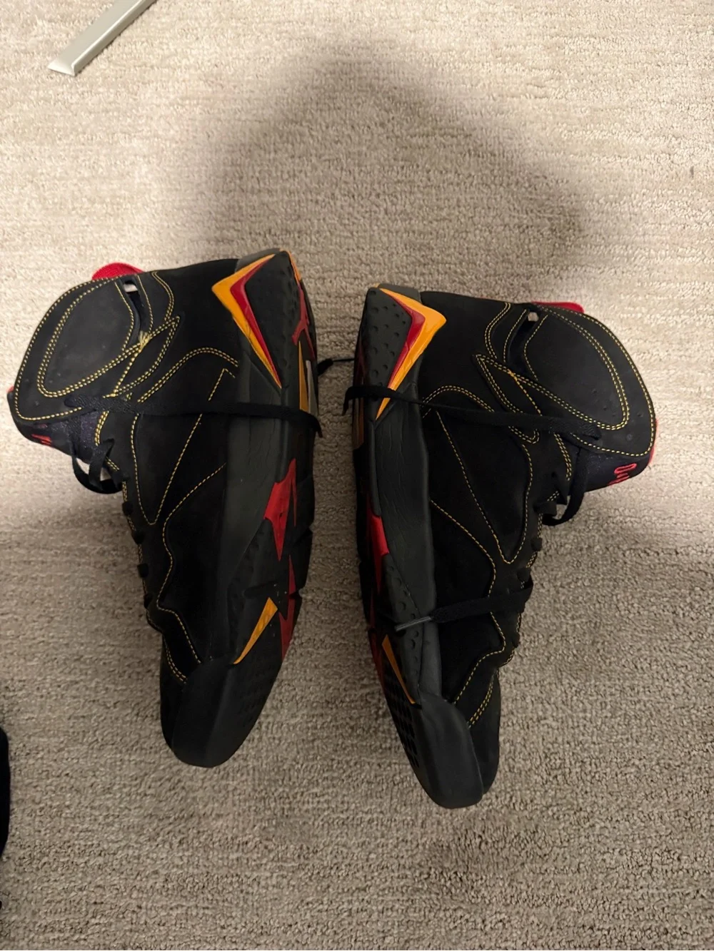 Jordan Black Sneakers with Red Pull Tabs and Yellow Accents